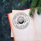 A personalized book stamp in round, the top is text -from the library of, the centre is the graphic of moon, sun, diamond and hands, the bottom is to custom your name.