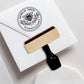 A personalized self inking address stamp, customized with your name and address, bee and flower, stamped on the white envelope of invitation card.
