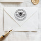 A personalized self inking address stamp, customized with your name and address, bee and flower, stamped on the white envelope, beside it, a wax seal is waiting for sealing the mail.
