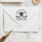 A personalized self inking wedding address stamp, customized with your name and address, bee and flower, stamped on the white envelope, beside it, a wax seal is waiting for sealing the mail.