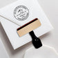 A personalized self inking address stamp, customized with your name, address and mountain, stamped on invitataion card.