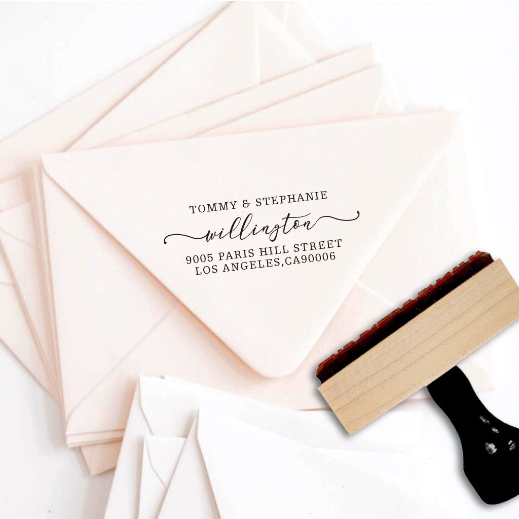 A personalized self inking address stamp, customized with your name and address, stamped on the pink envelope..