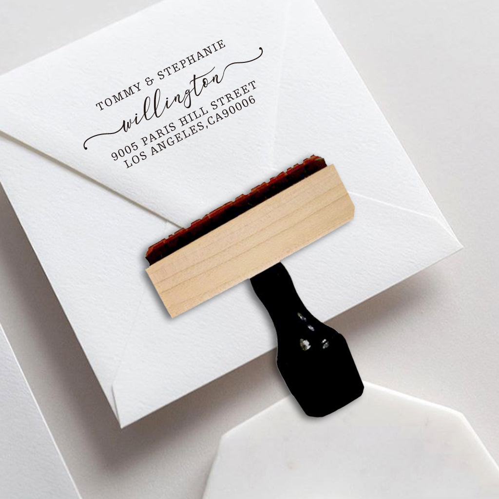 A personalized self inking wedding address stamp, customized with your name and address, stamped on the white envelope of invitation card.