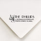 A personalized self inking return address stamp, customized with your shop name and address, stamped on the white envelope.