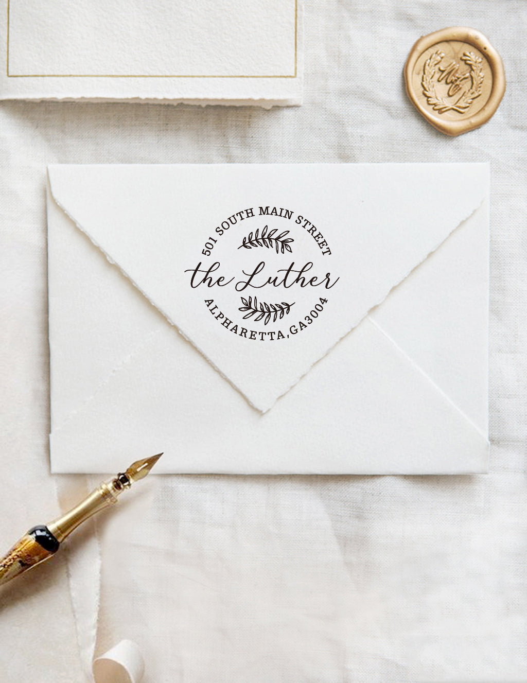A personalized self inking address stamp, customized with your name and address, stamped on the white envelope, beside it, a wax seal is waiting for sealing the mail.