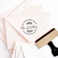 A personalized self inking address stamp, customized with your shop name and address, stamped on the pink envelope.