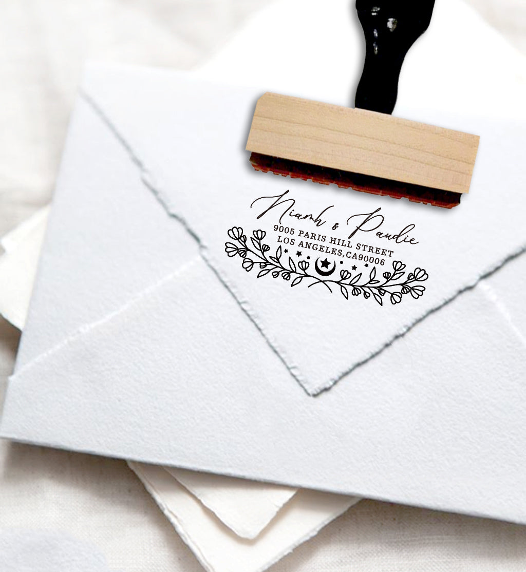 A personalized self inking address stamp, customized with your name, address and flower, stamped on the white envelope.