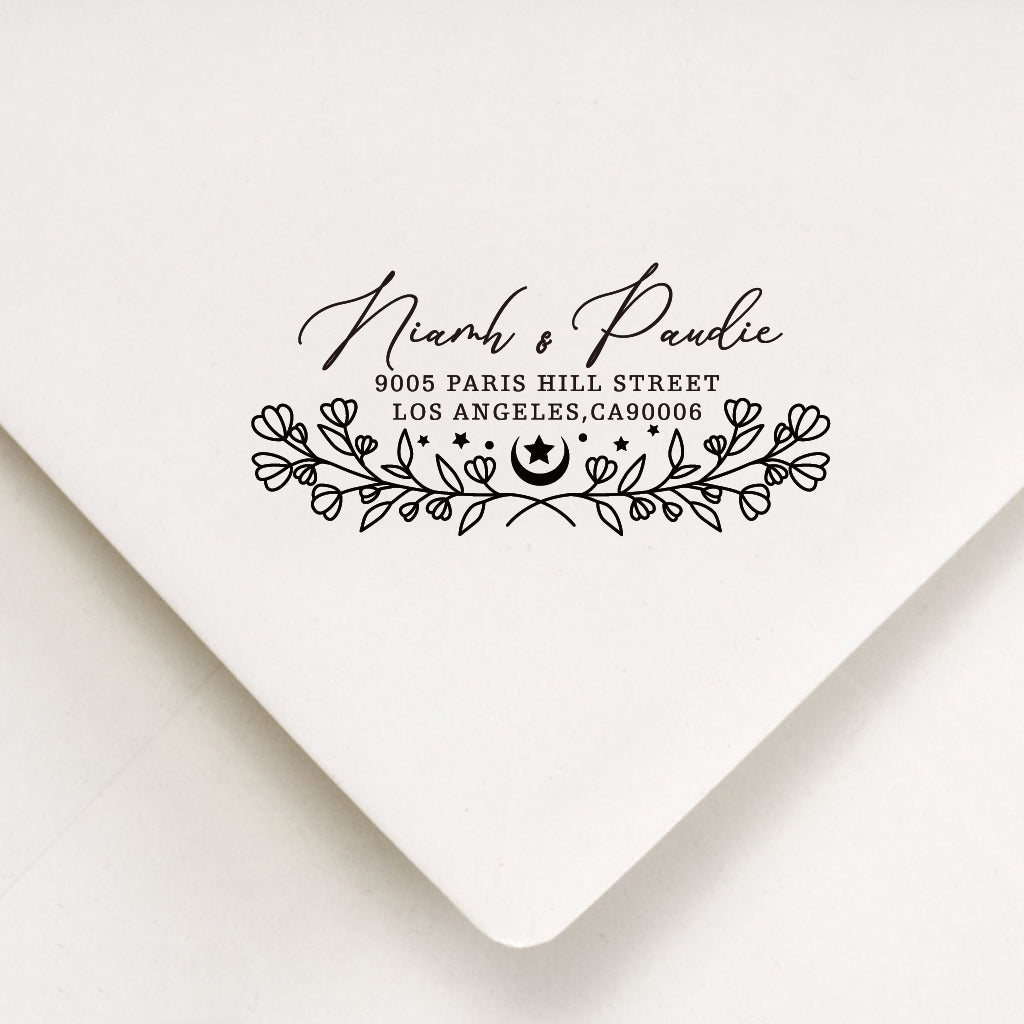 A personalized self inking address stamp, customized with your name, flower and address, stamped on the white envelope.