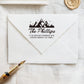 A personalized self inking address stamp, customized with your mountain name and address, stamped on the white envelope, beside it, a wax seal is waiting for sealing the mail.