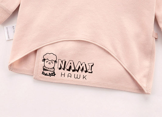 Custom Clothing Stamp, imprinted on a pink clothes. A cartoon sheep wear the shawl and the custom name at it's right side.